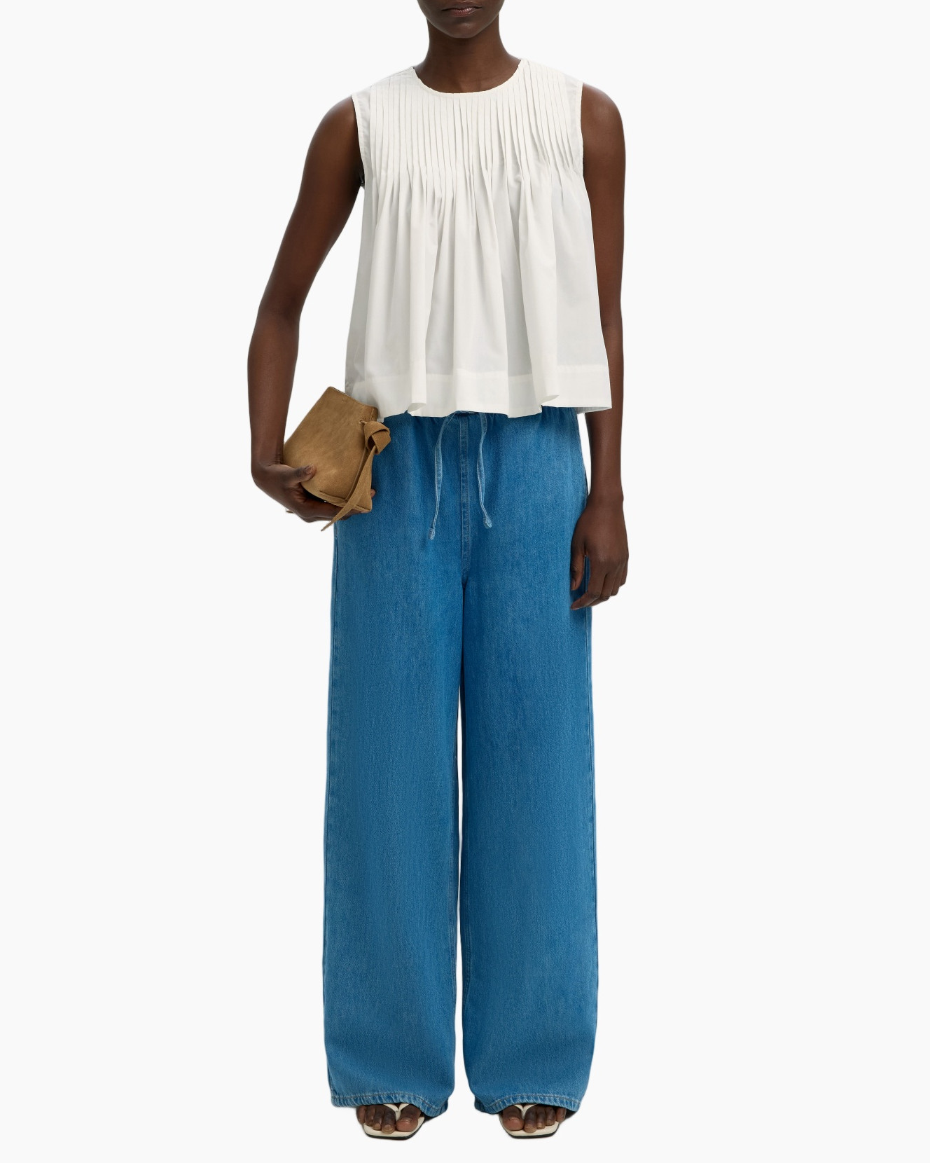 top zonder mouwen, geplooid, wit, peplum, brede pijpen jeans