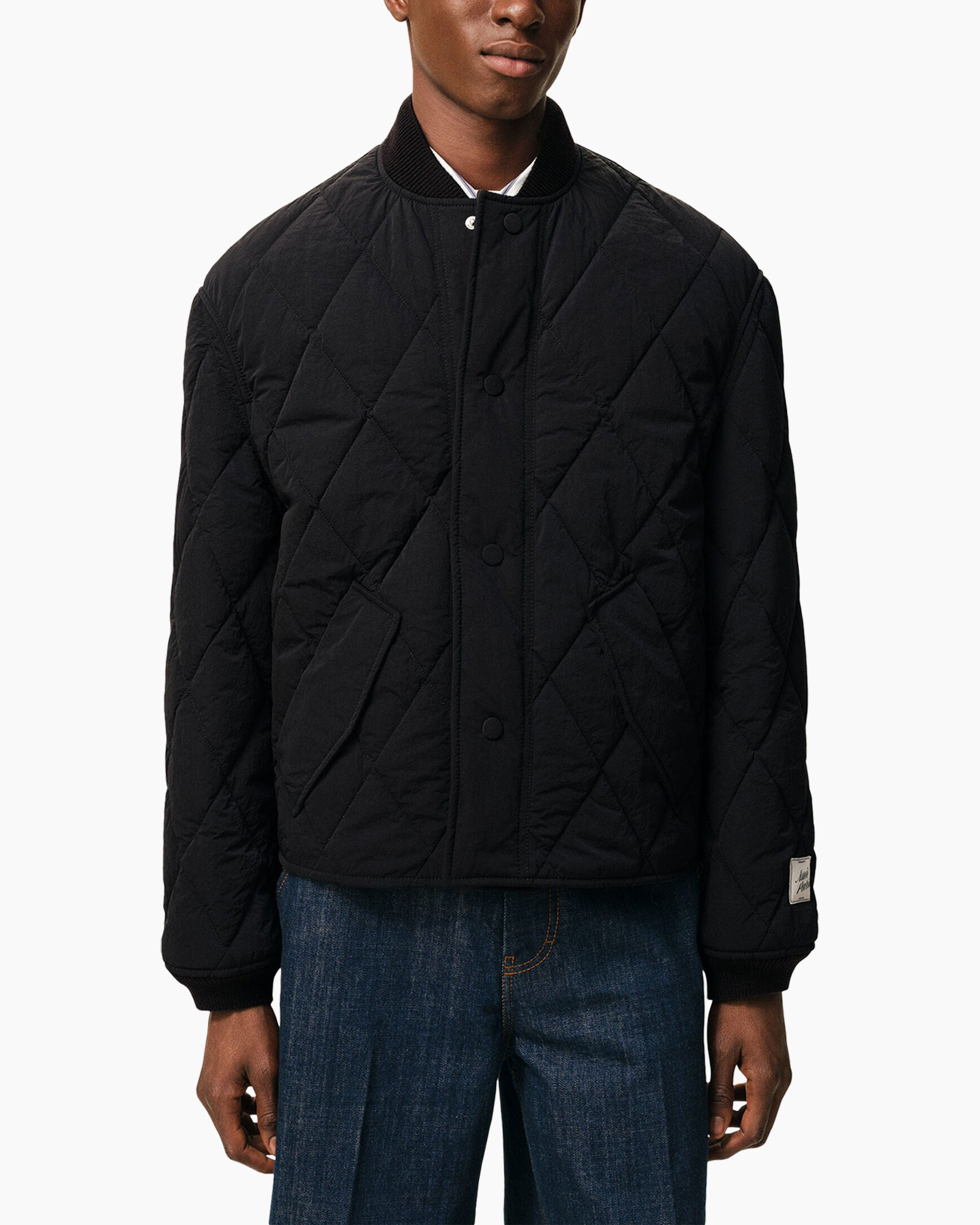 jasquilted jas, zwart jasje, diagonaal gevoerd quilt, drukknop, geribde manchetten