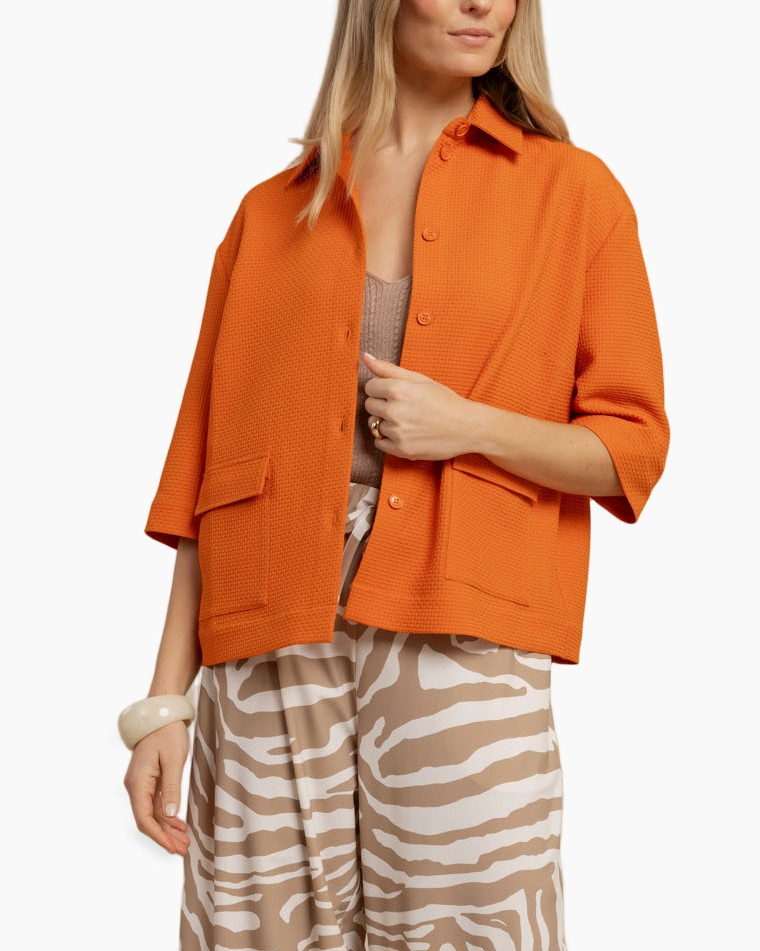 oranje bovenstuk, korte mouwen top, kraagtop, textured stof, losvallend fit
