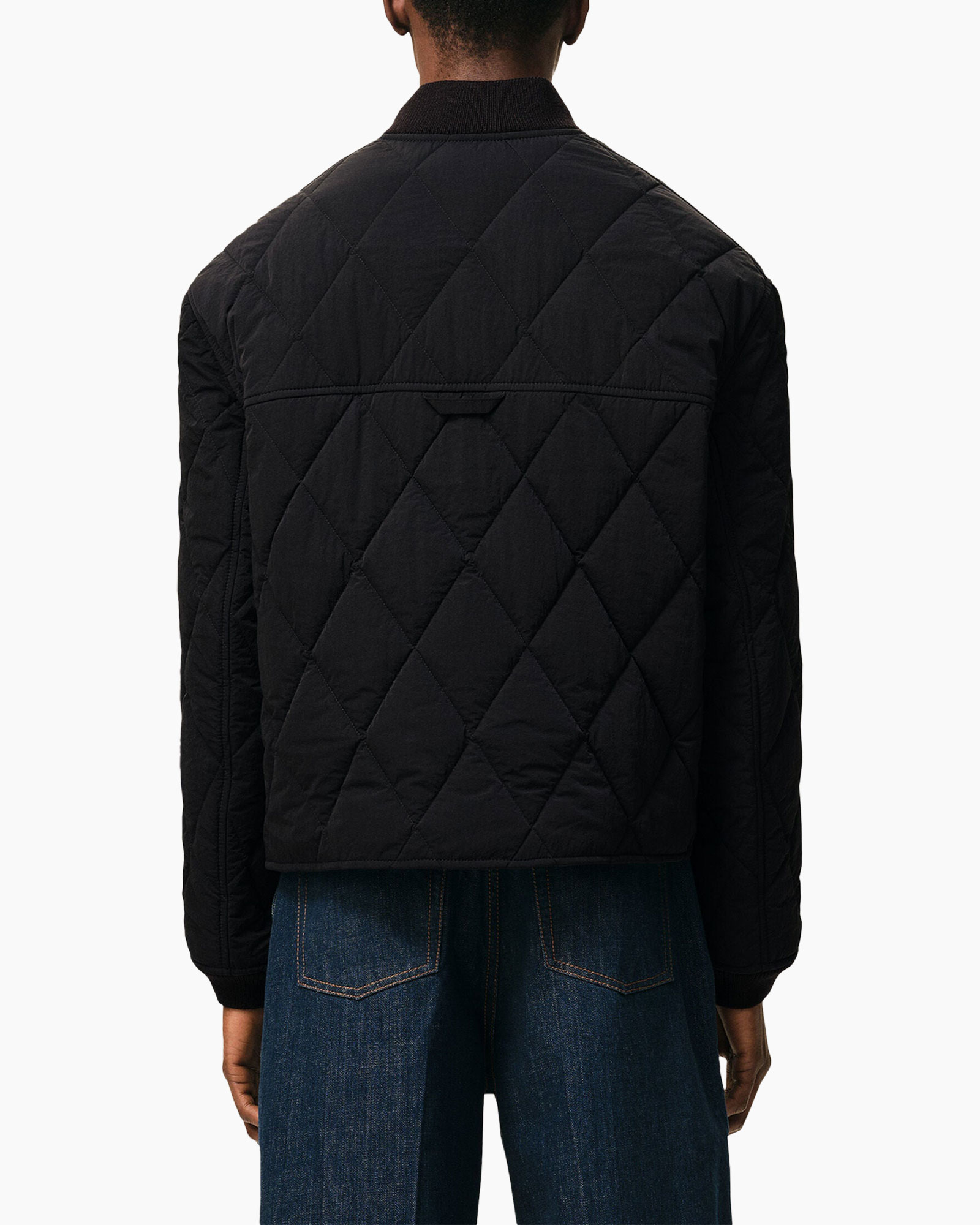jasquilted jas, zwart jasje, diagonaal gevoerd quilt, drukknop, geribde manchetten