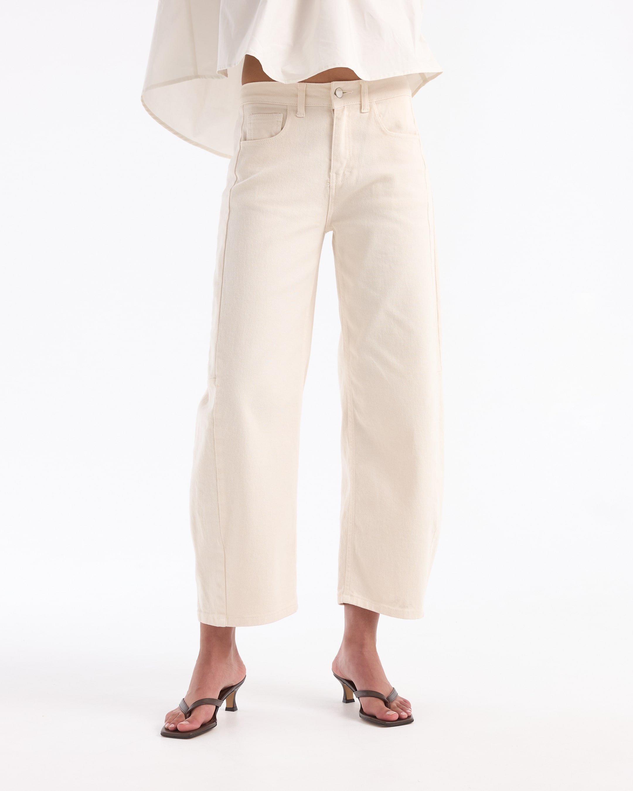 off-shoulder top, cream blouse, loose fit, high-waisted jeans, sandals