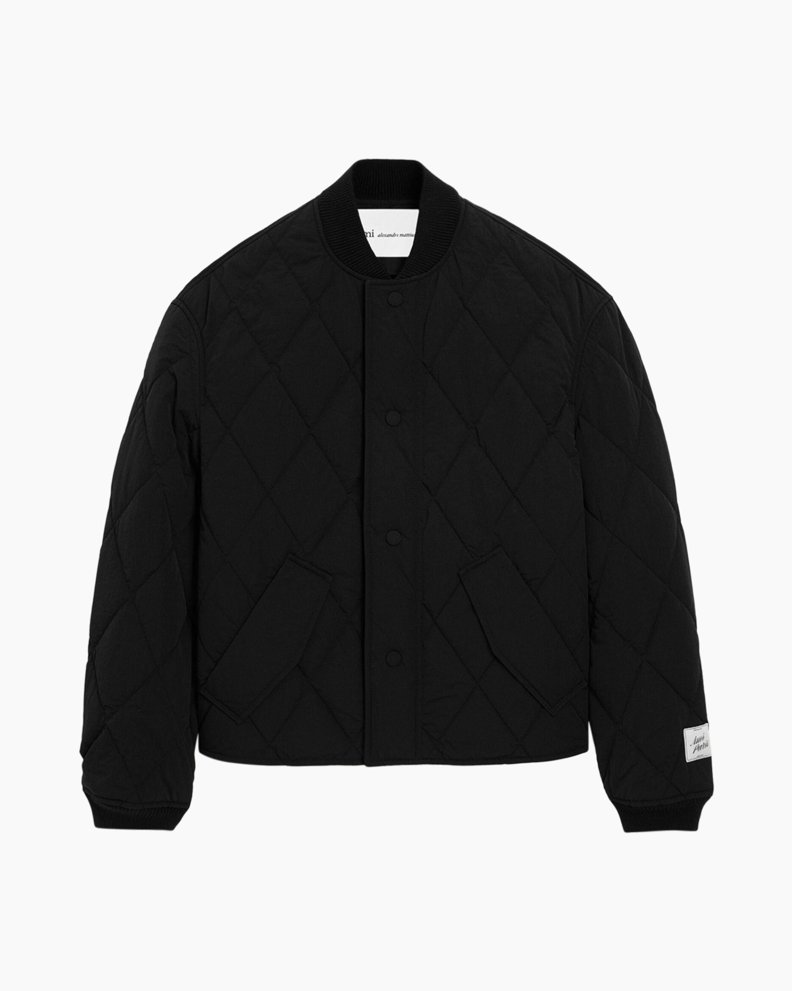 jasquiltjasje, zwart, gebreide manchet, drukknoopsluiting, zakzakken