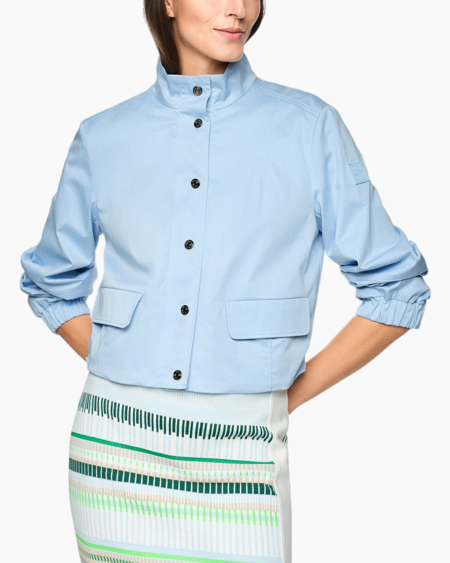 light-blue jacket, button-up jacket, collared jacket, pocketed jacket, rolled sleeve