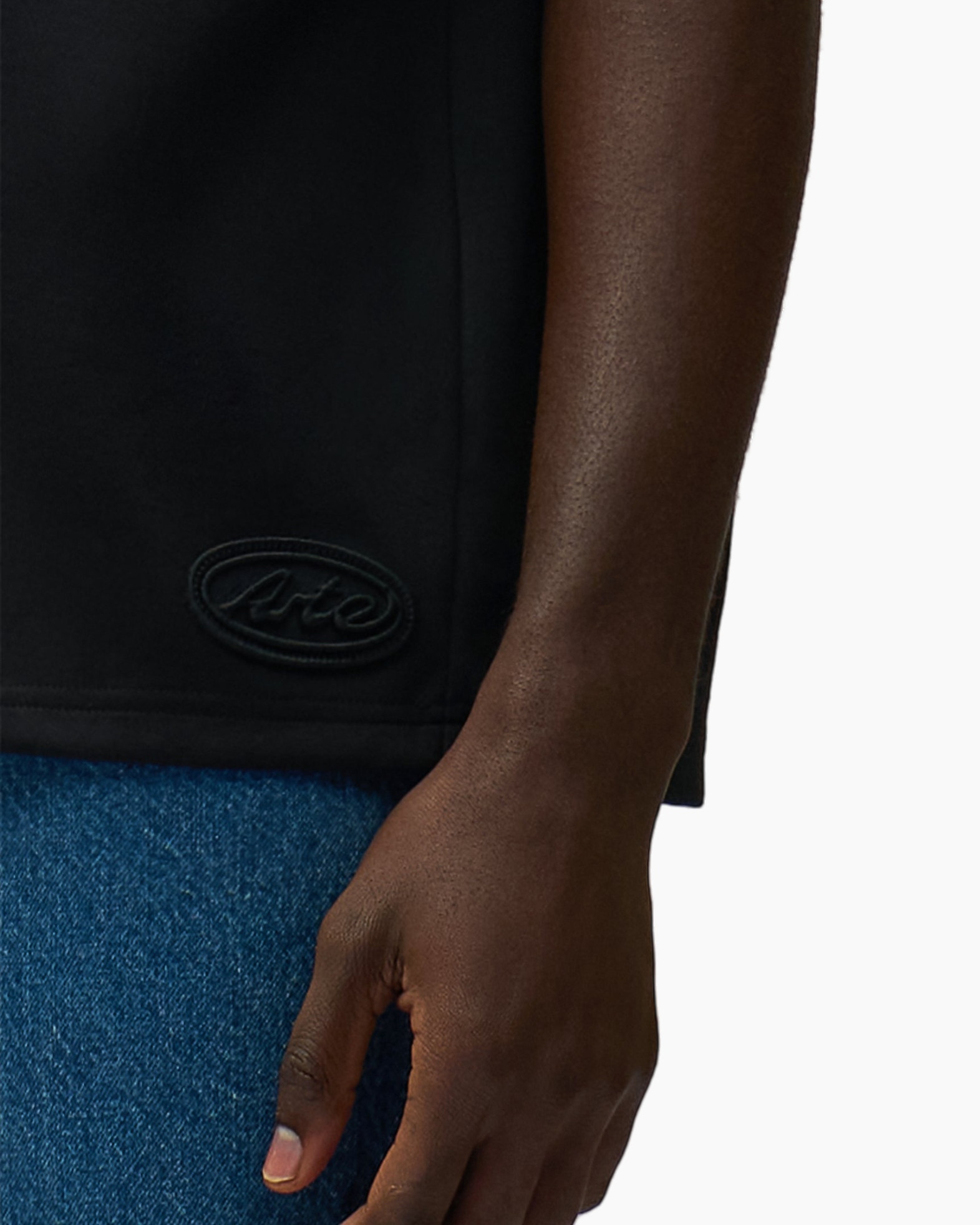 black top, logo patch, short sleeve, cropped hem, denim jeans