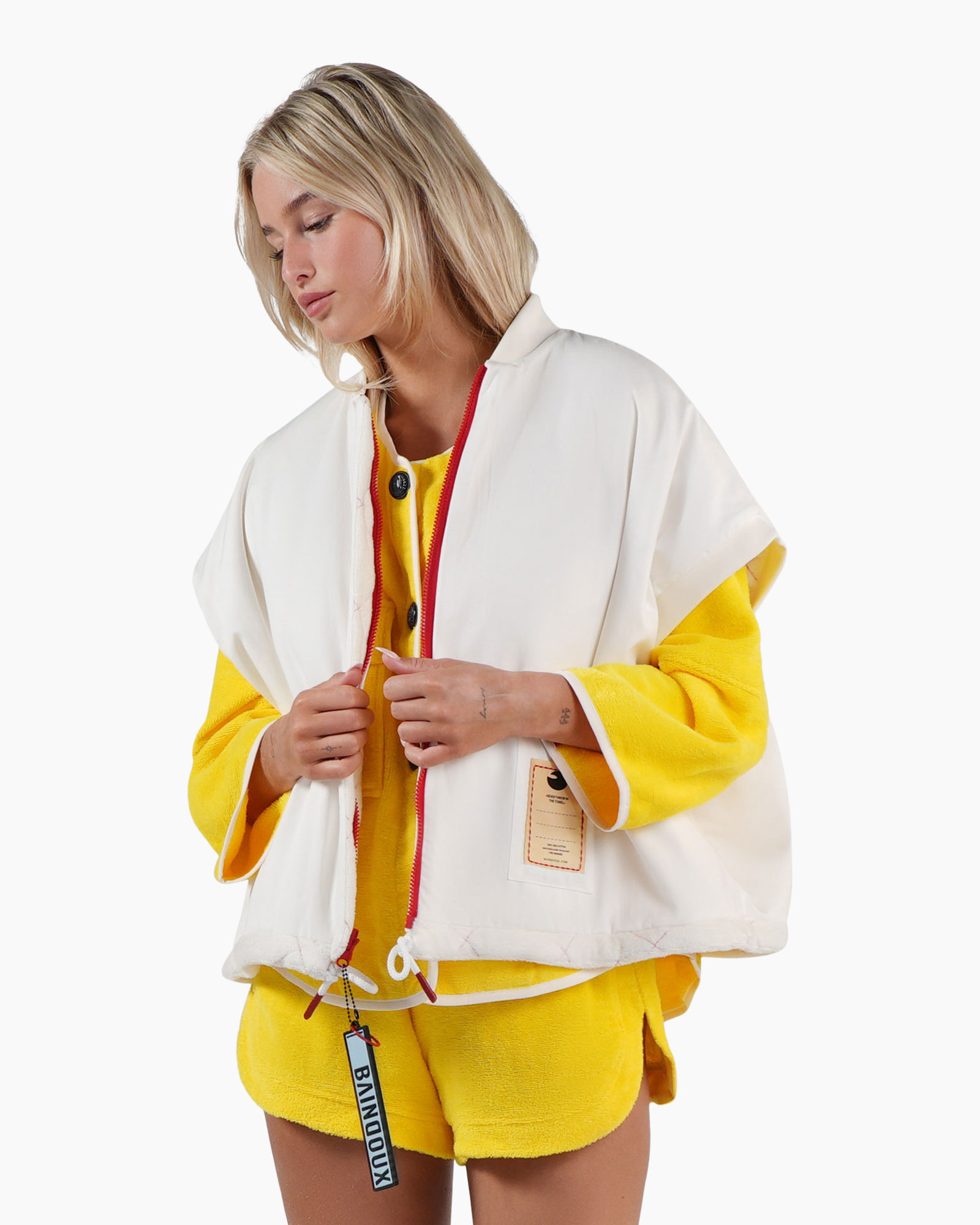 puffer vest, white vest, red zipper, yellow outfit, shorts