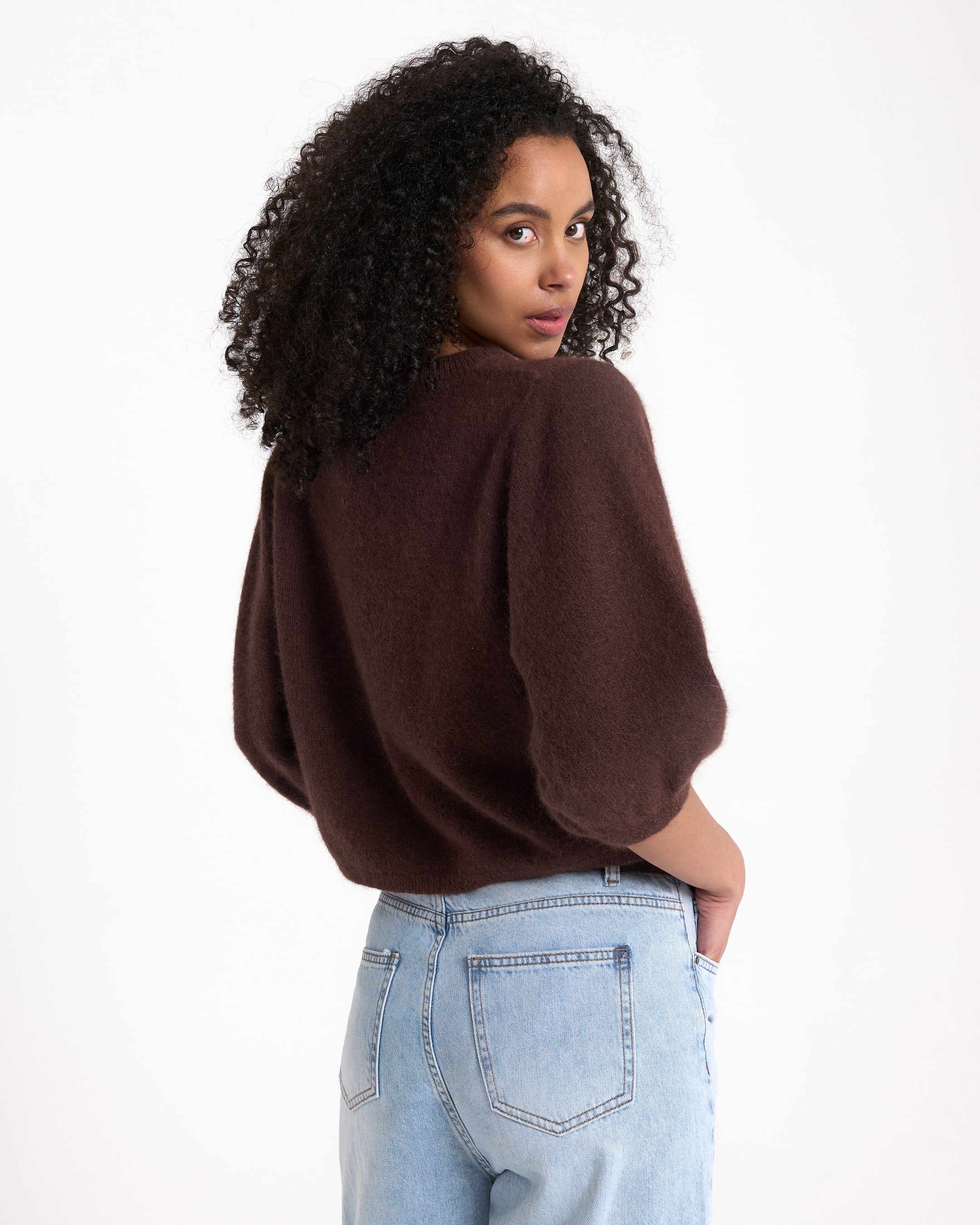 brown sweater, knit top, loose fit, short sleeves,  jeans shorts? wait, denim jeans back view
