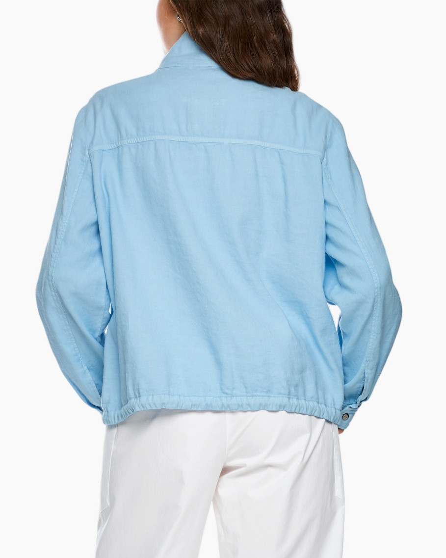light-blue jacket, windbreaker, snap-button front, drawstring hem, white pants