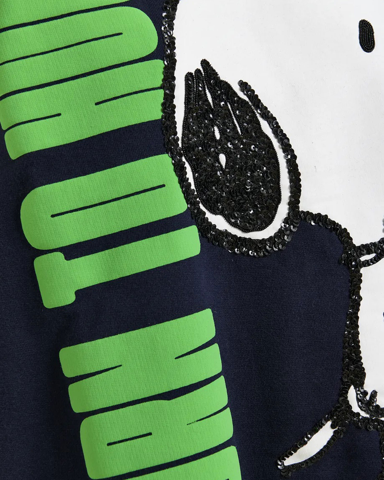 green graphics, sequins, embellished, navy fabric, text print