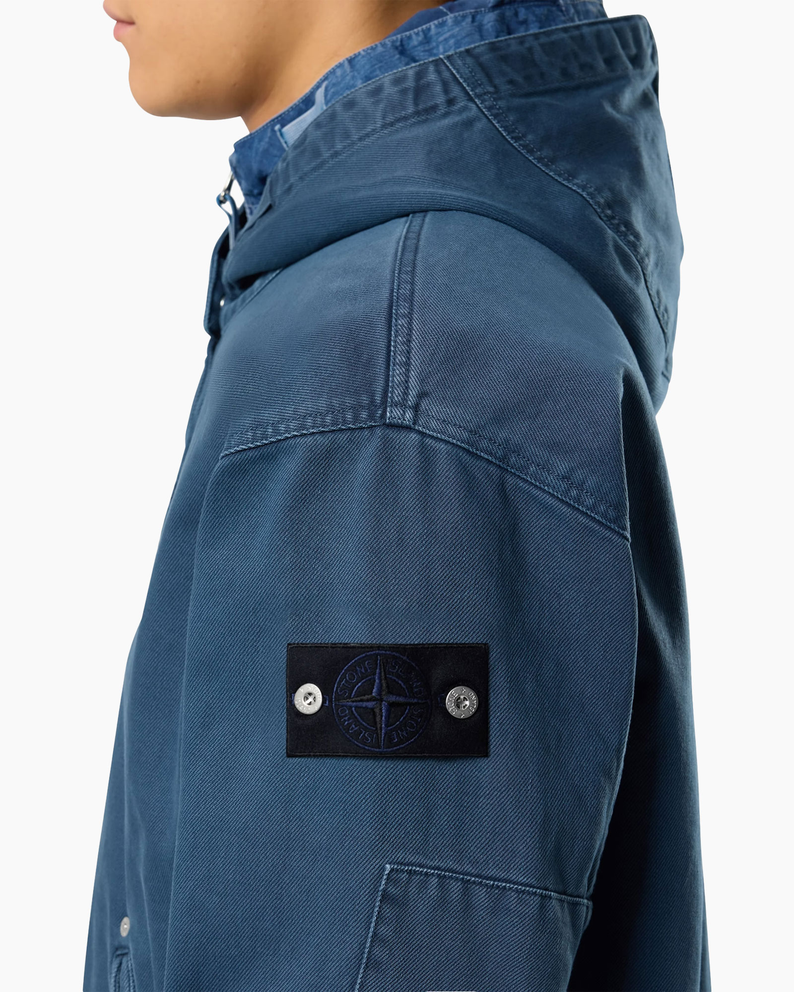 blue jacket, hooded, stone island patch, sleeve patch, buttoned pocket