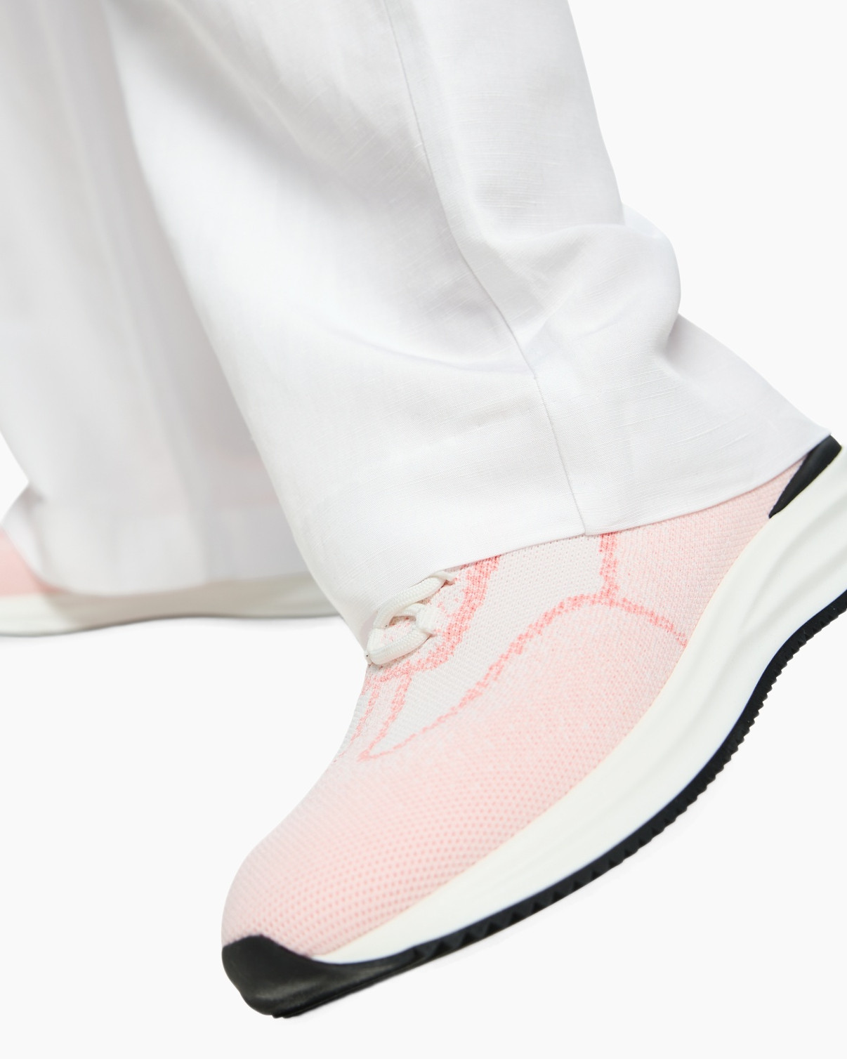 pink sneakers, mesh upper, white pants, athletic shoe, rubber outsole
