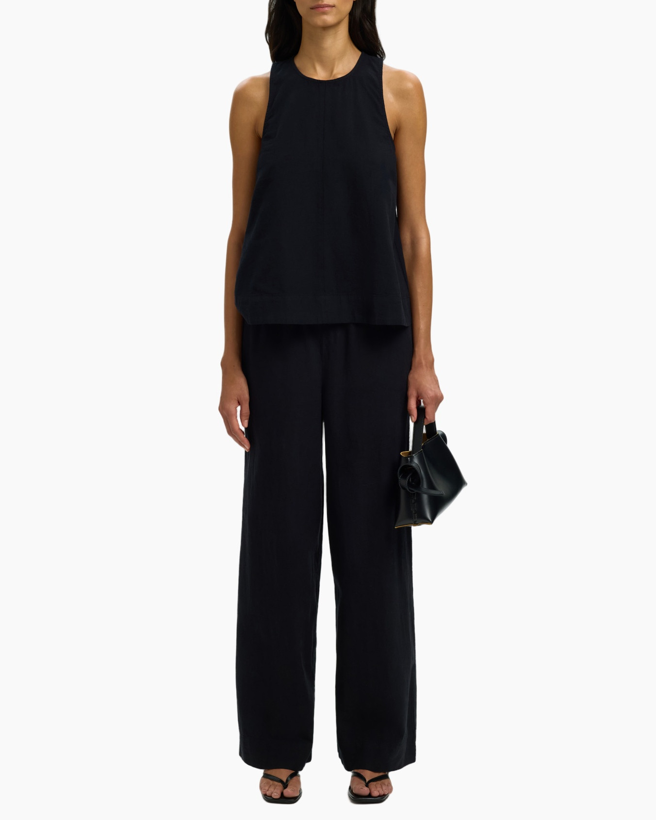 black top, wide-leg pants, sleeveless, monochrome, purse