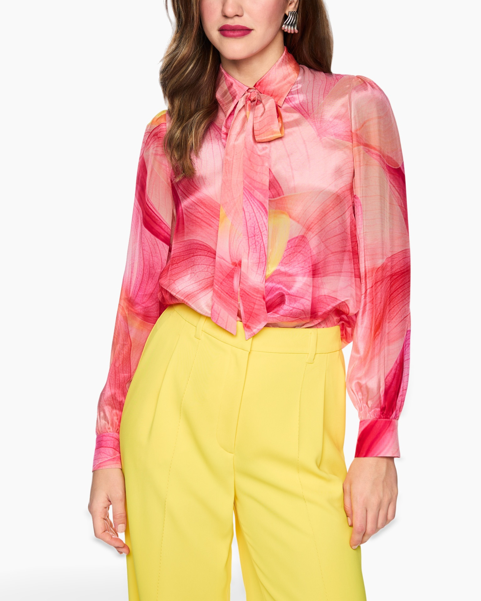 pink blouse, tie-neck, sheer sleeves, colorful pattern, yellow trousers
