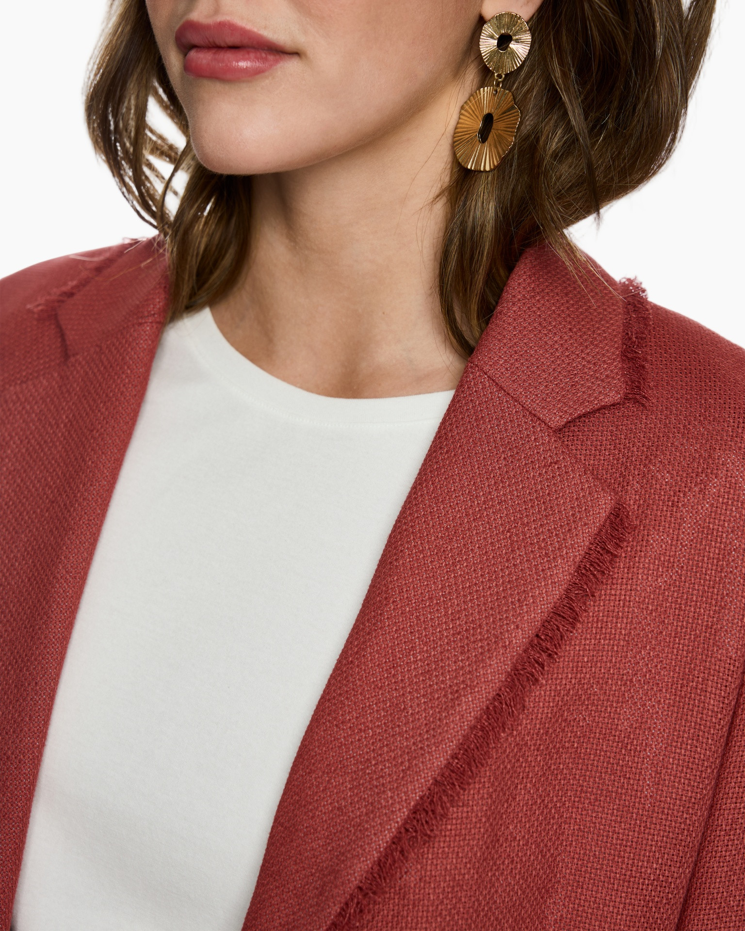 red blazer, textured fabric, notched lapel, white top, gold earrings