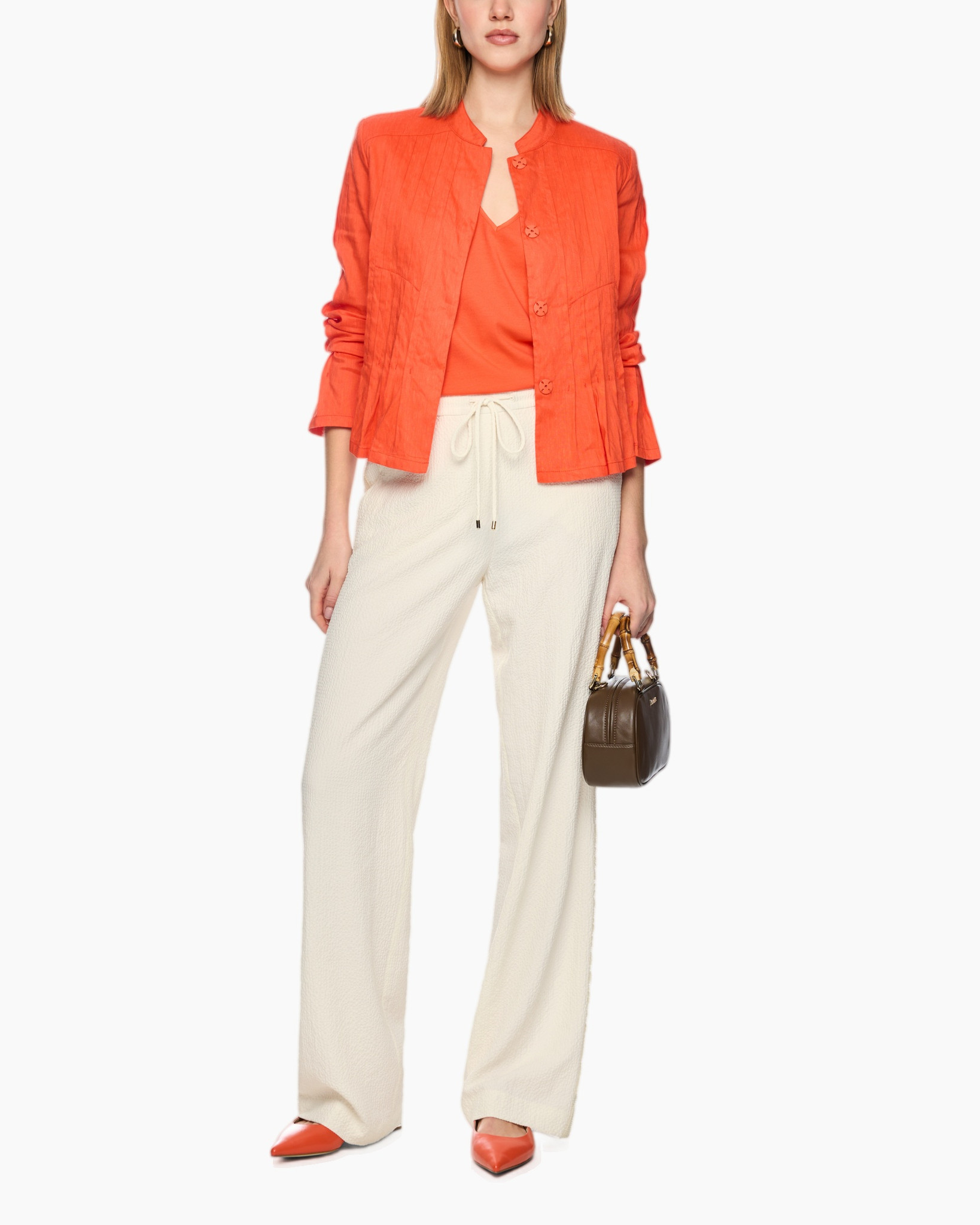 oranje jas, knopen jas, linnen jas, wijdere broek, oranje flats