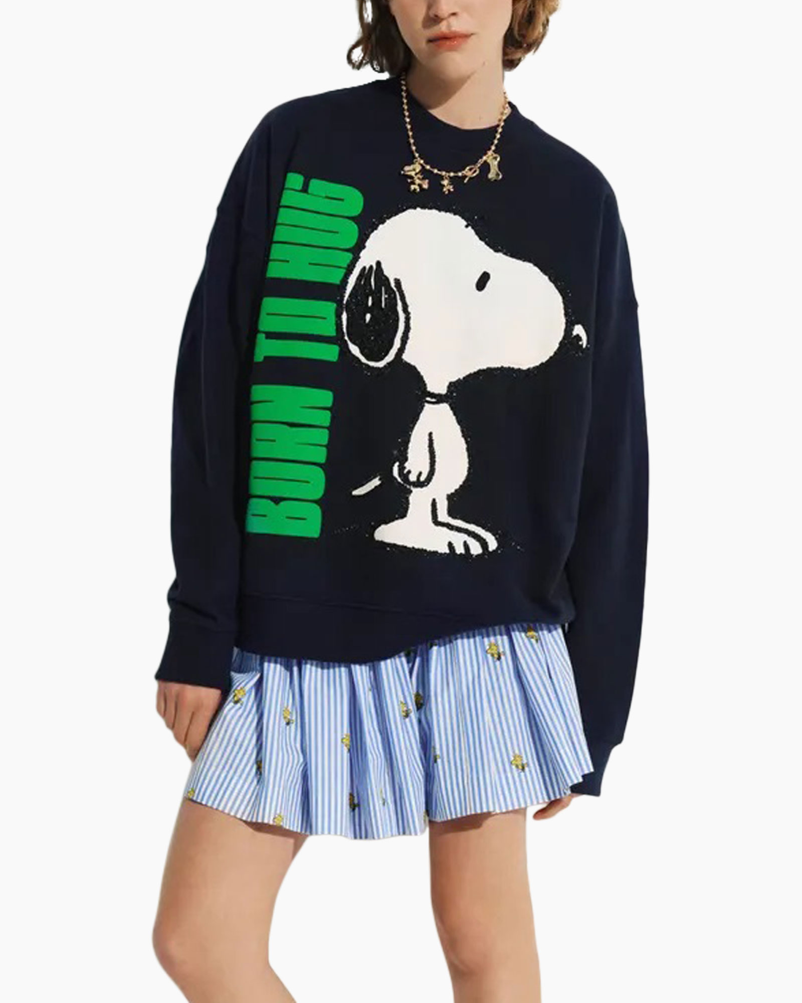 snoopy sweater, graphic sweatshirt, navy blue, green text, pleated skirt