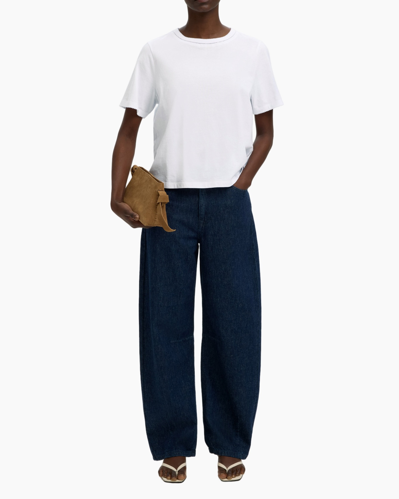 white t-shirt, loose jeans, denim pants, brown clutch, sandals