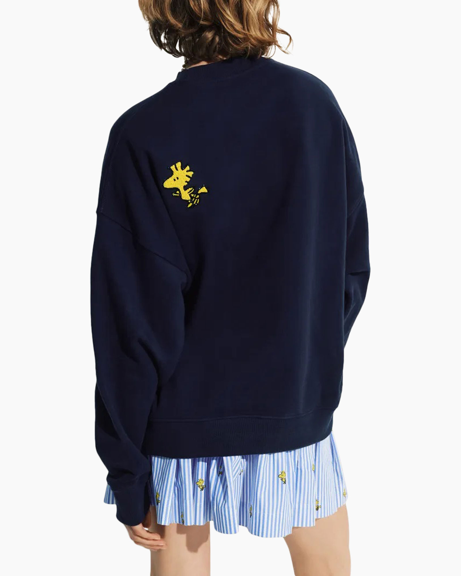 snoopy sweater, graphic sweatshirt, navy blue, green text, pleated skirt
