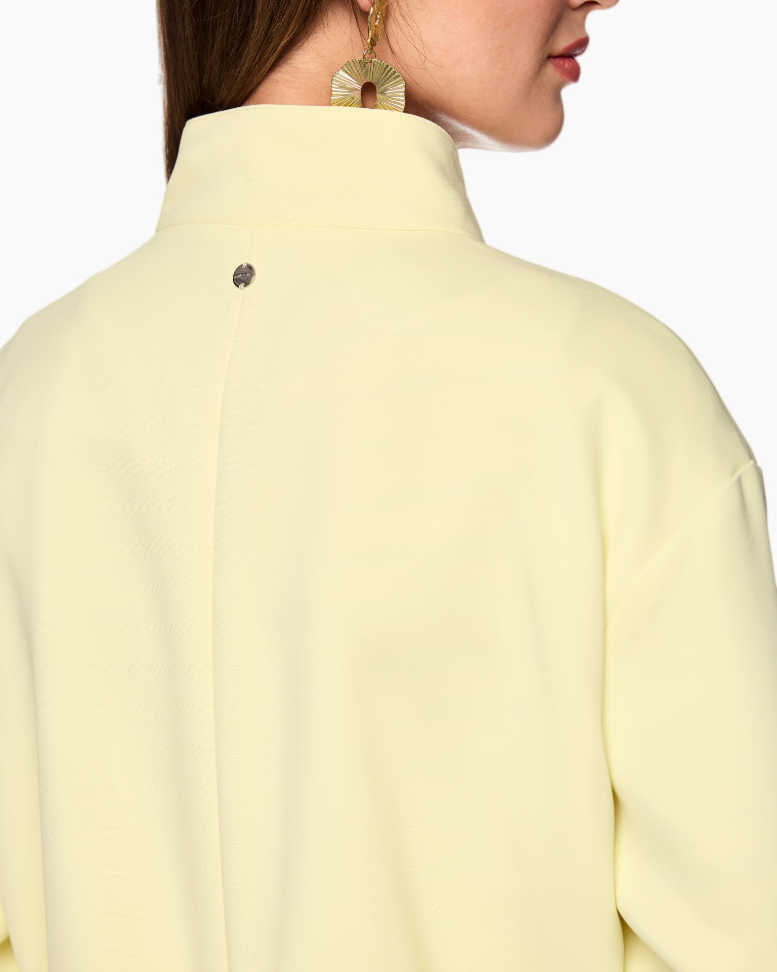 yellow, collar, back view, button detail, earring visible