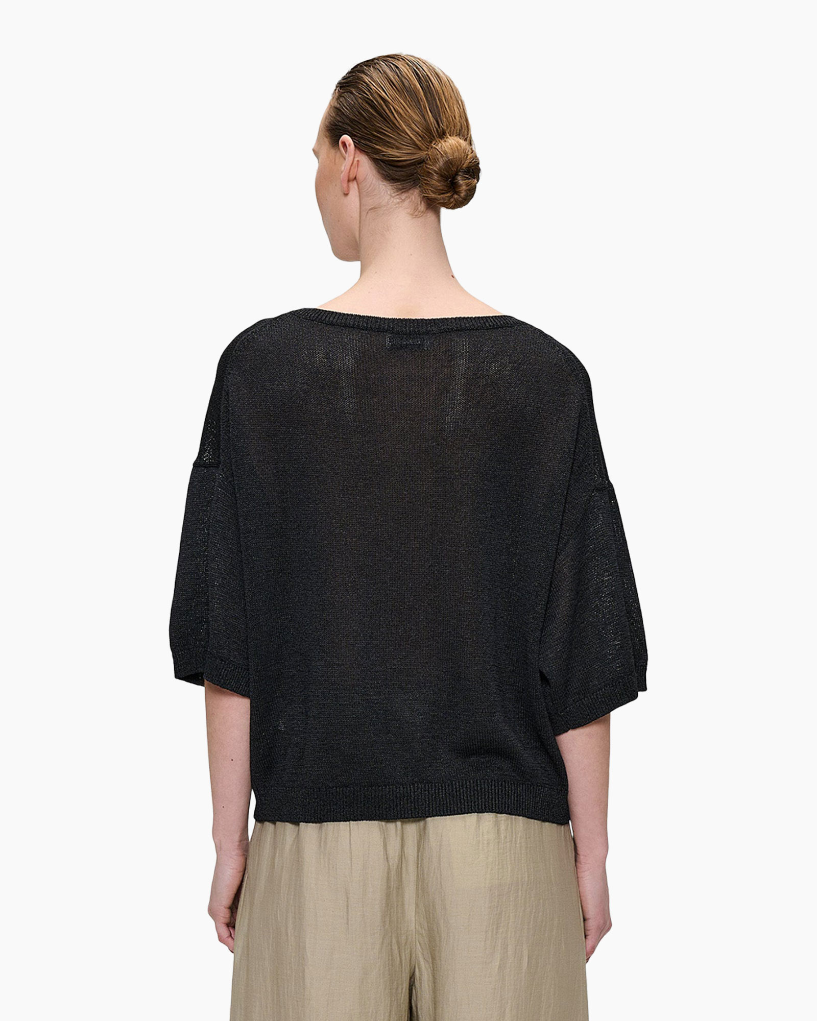 black knit top, loose fit, 3/4 sleeve, crew neck, beige trousers